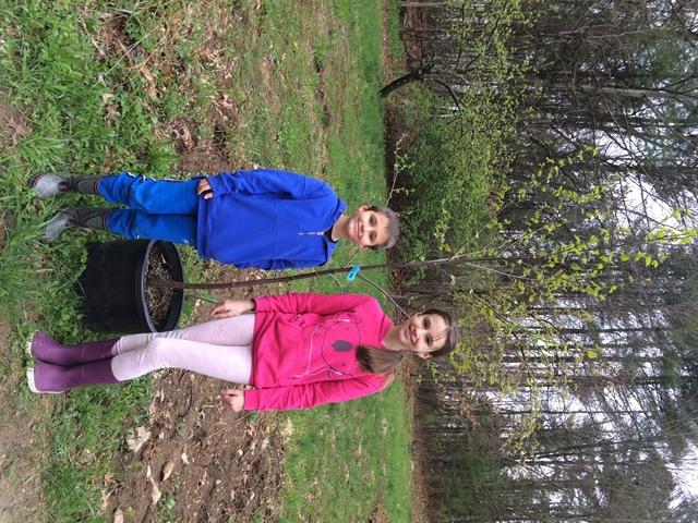 River Walk Tree ID Winner, Alexander and his sister, Sofia with the birch tree they won on Arbor Day.